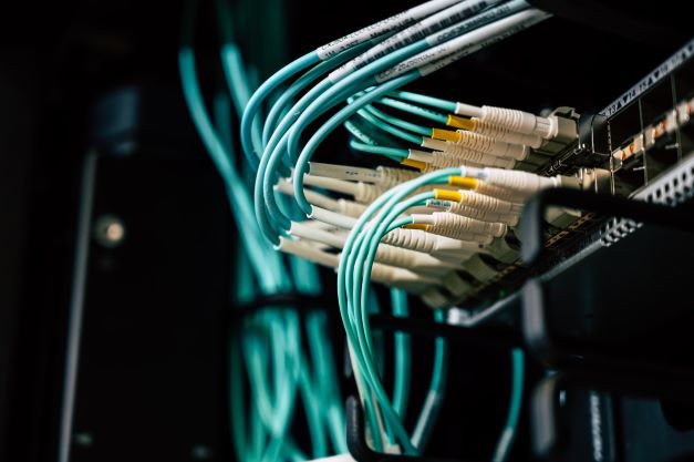 Fibre optic cables connecting into a networking switch
